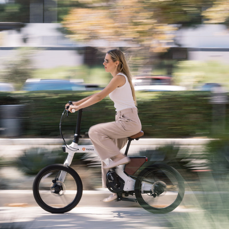 Load image into Gallery viewer, A female model with a white Innovator on the road